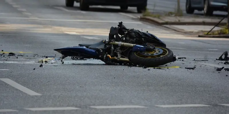 Damaged motorcycle lying on a street