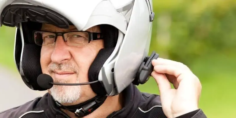 Motorcycle rider with headset in helmet