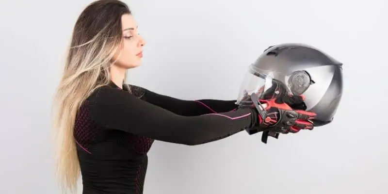 Woman holding a helmet