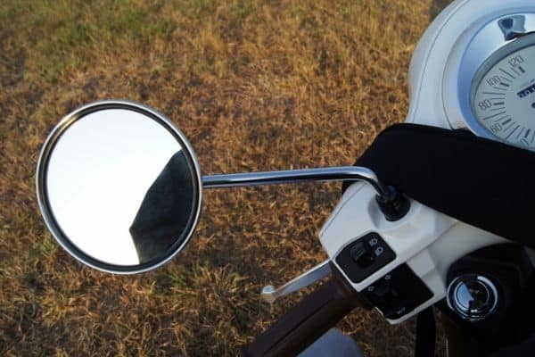 side mirror in white and black motorcycle