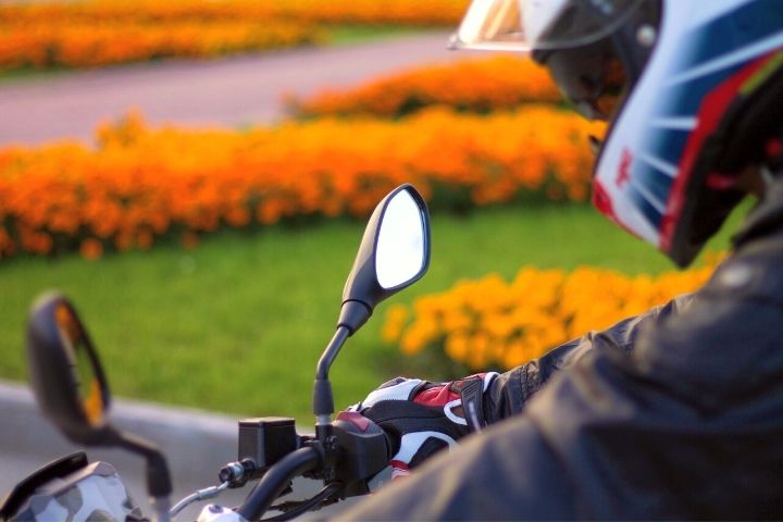 Man On Motorcycle With Flowers On A Background
