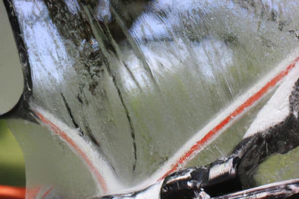 Motorcycle Windshield Being Washed