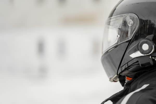 Profile Of A Motorcycle Rider Wearing A Black Helmet