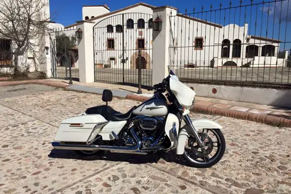 Harley Davidson Street Glide Special Parked In Front Of A Mansion