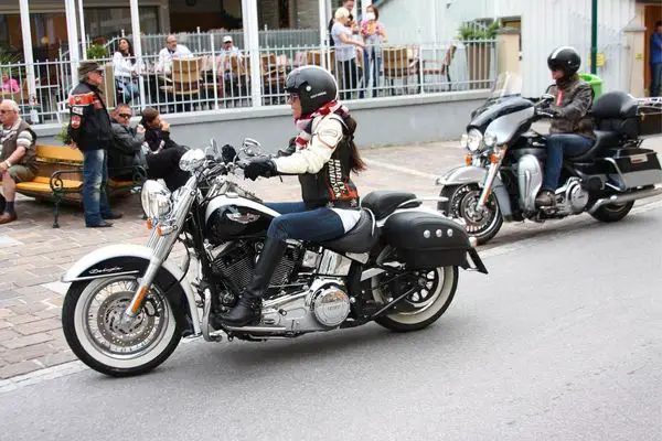 A Female Motorcyclist Riding Harley Softail Deluxe