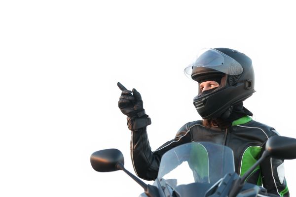 A Woman Motorcycle Rider Pointing To The Left