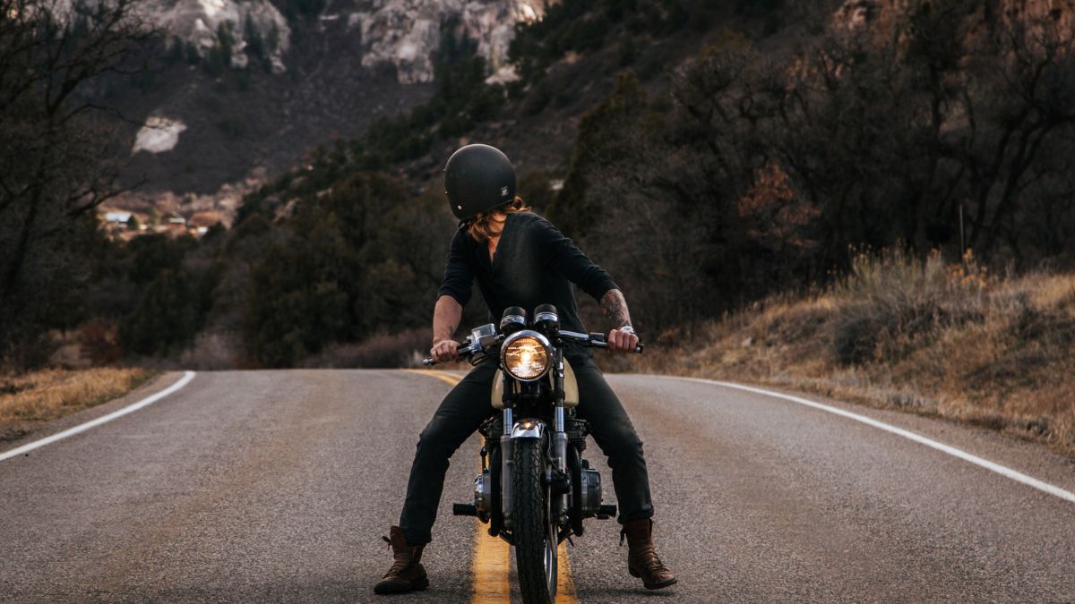 Female Motorcycle Rider Looking Back