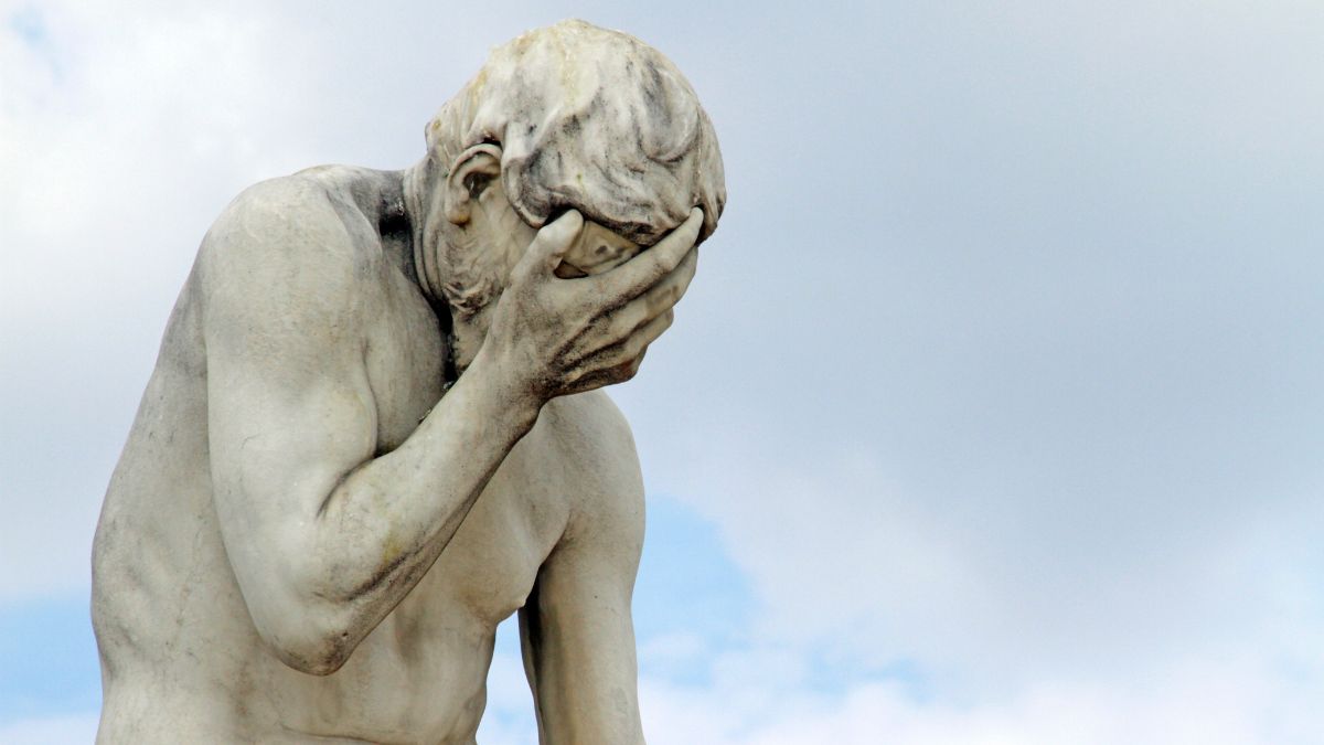 Statue Of A Man Doing A Facepalm